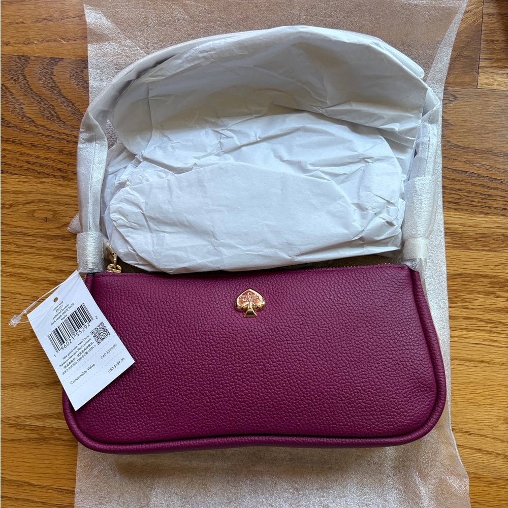 NWT Kate Spade Kayla Wristlet Dark Raspberry color